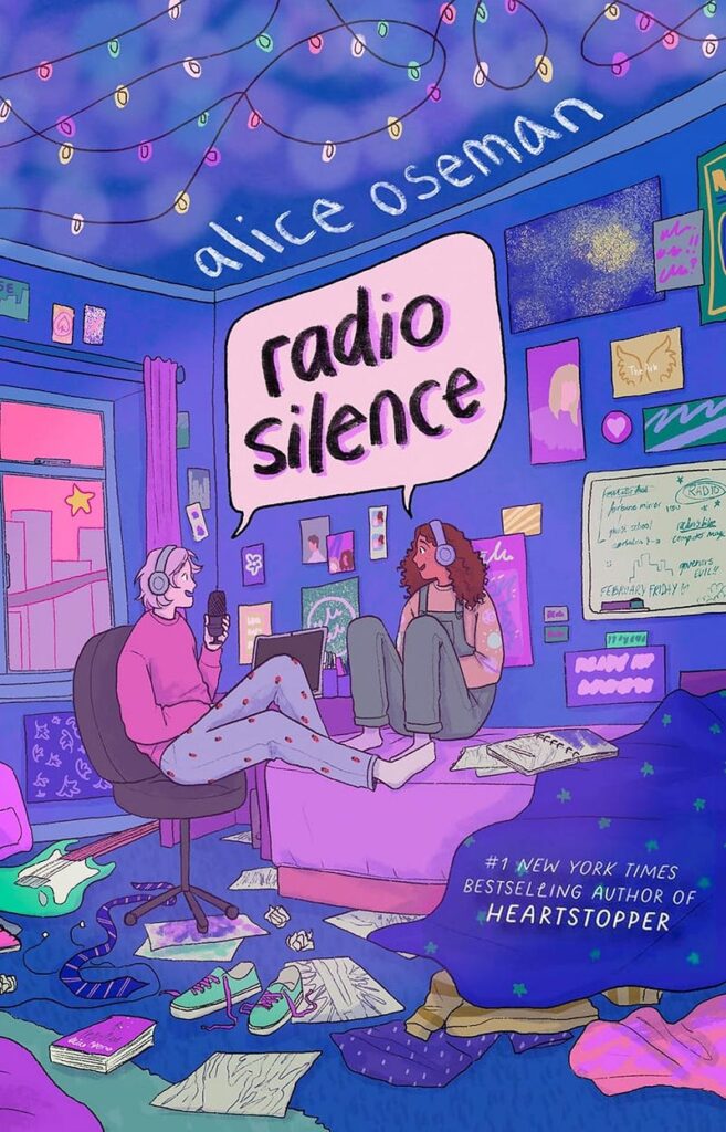 The book cover of RADIO SILENCE: in a dark blue bedroom with pink highlights, a curly-haired brown femme and a blond-haired masc are chatting with headphones on. The title is in a shared speech bubble between them. Also, Godaminit that's an Easter egg. One of the books splayed on the bedroom floor uses the original cover of Loveless ‒ another one of Oseman's novels. Well played, Oseman. Well played.