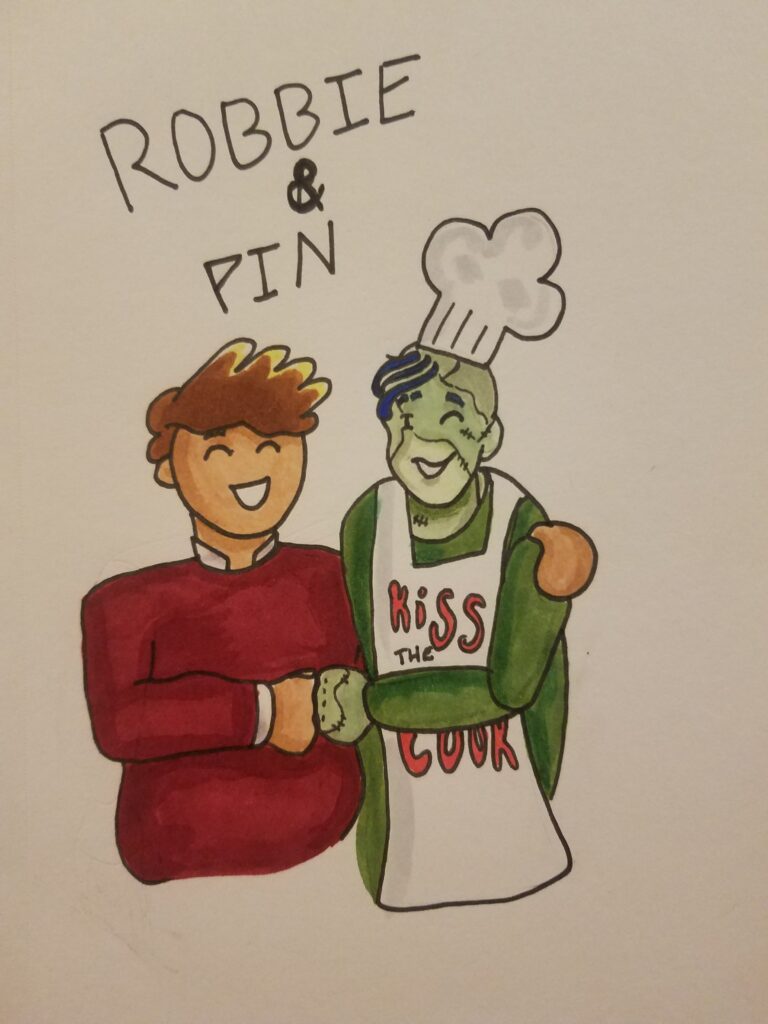 Anna Stein's fanart of Robbie Middleton and Pin Cushion: to the left, the human Robbie in a red jumper and white collared, long-sleeve shirt has an arm slung around the green zombie Pin's shoulders. Pin, to the right, is wearing a chef's hat and an apron reading KISS THE COOK, both white.